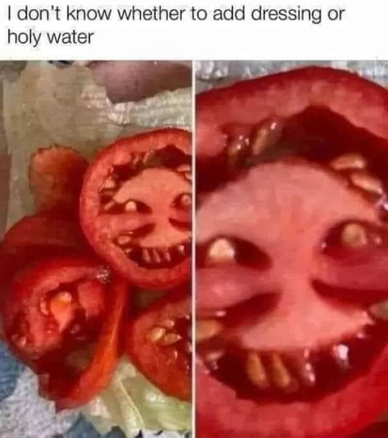 Tomato slices with faces resembling a smiling face and a surprised face.