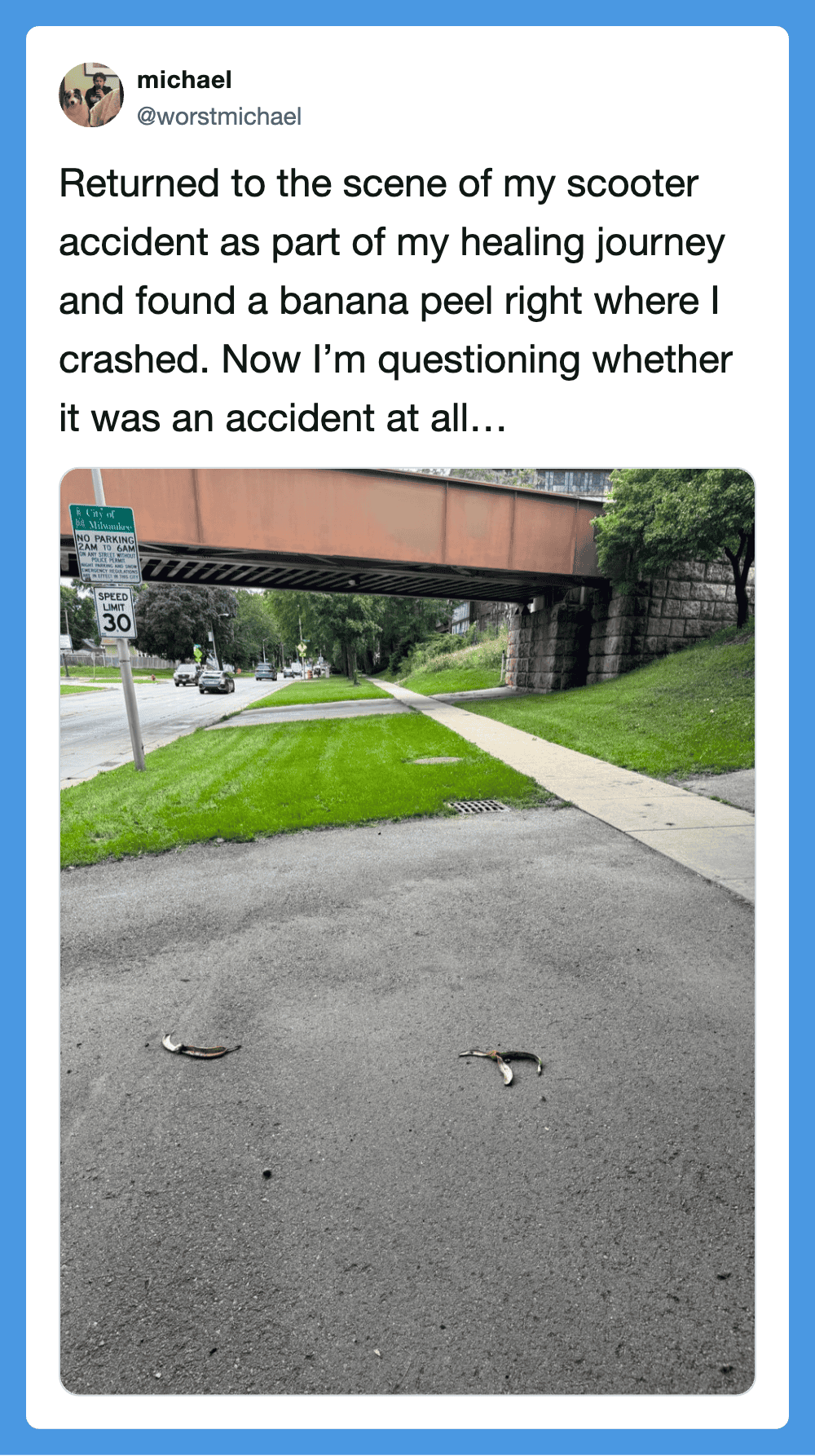 Scooter accident scene with banana peels on the ground under a bridge.
