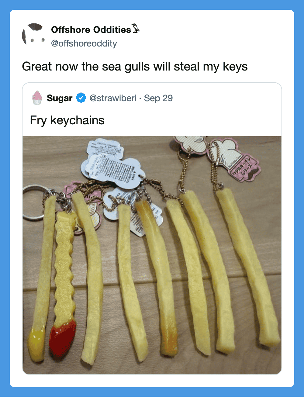 Fry keychains resembling French fries with ketchup and mustard, on a wooden surface.