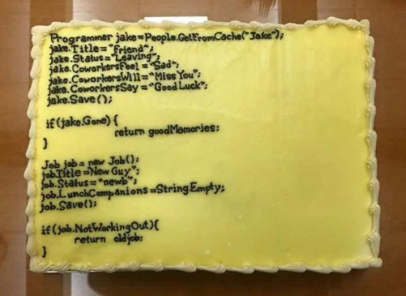 Cake with programming code and farewell message for Jake, a programmer quitting his job.