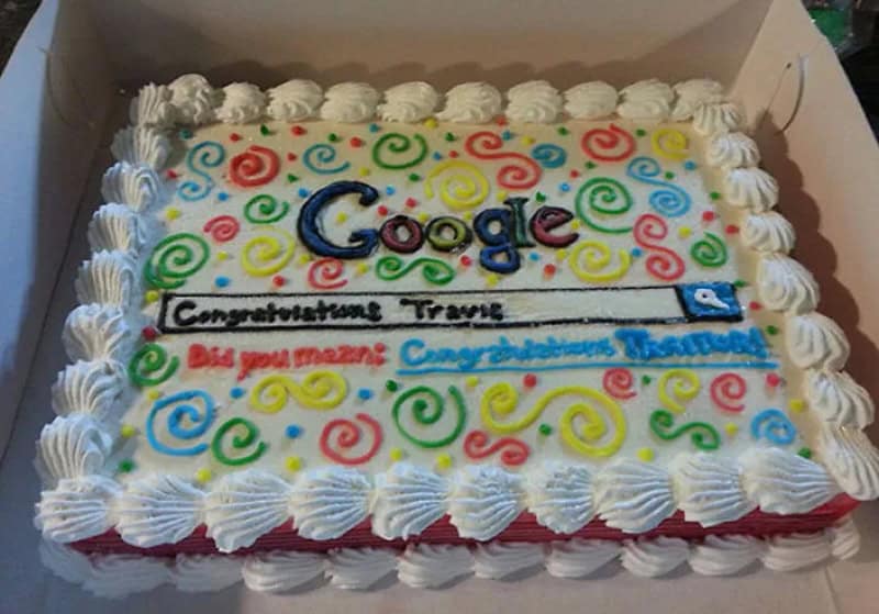 Celebration cake with colorful swirls, 'Google' logo, and congratulatory message.