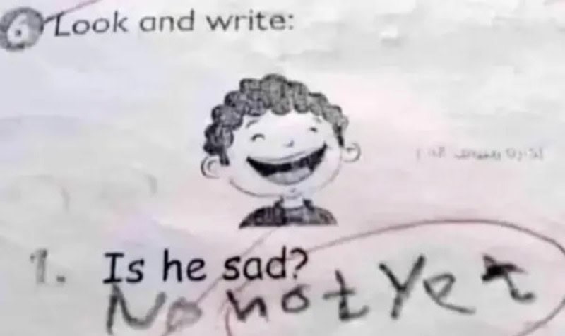 Child's handwriting says 'Not yet' in response to 'Is he sad?'.