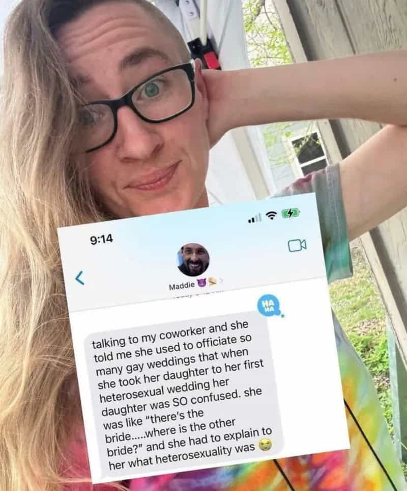Woman with glasses holding phone showing funny story about her daughter's wedding.