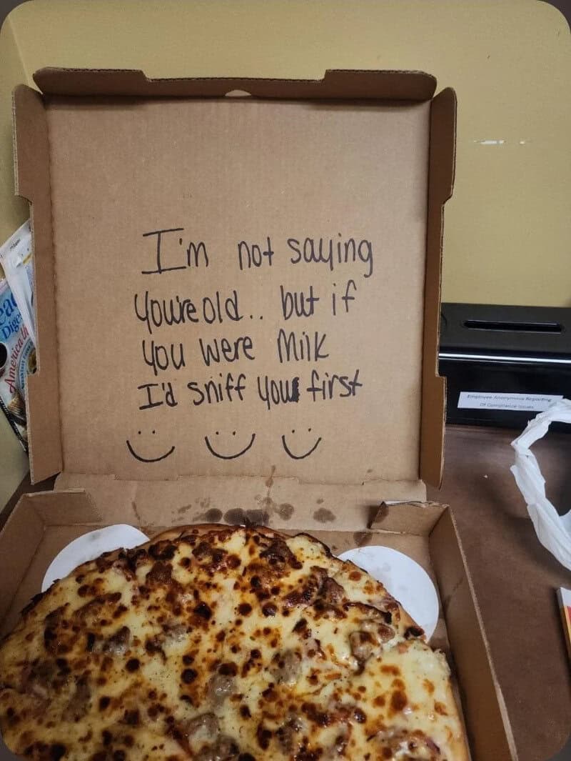 Pizza box with handwritten note inside, saying 'I'm not saying you're old... but if you were milk, I.
