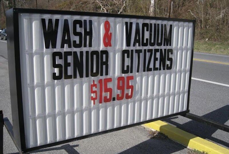Sign advertising wash & vacuum for senior citizens at $15.95.