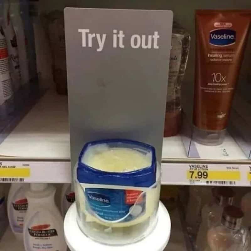 Try it out sign above Vaseline container on store shelf.