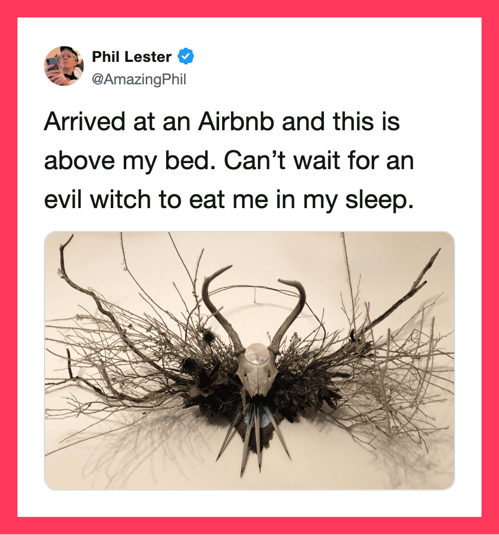 Tweet by Phil Lester about Airbnb with a photo of a skull and antlers on branches.