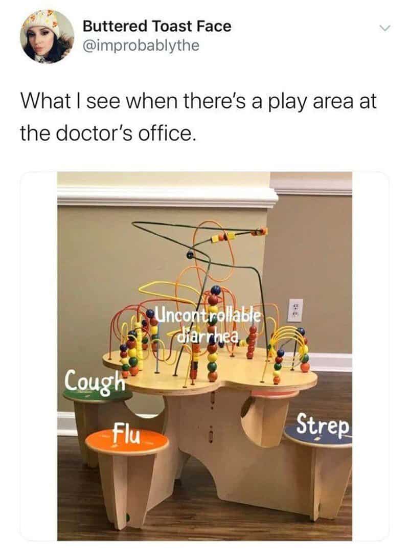 Play area at doctor's office with bead maze and signs for cough, flu, and strep.