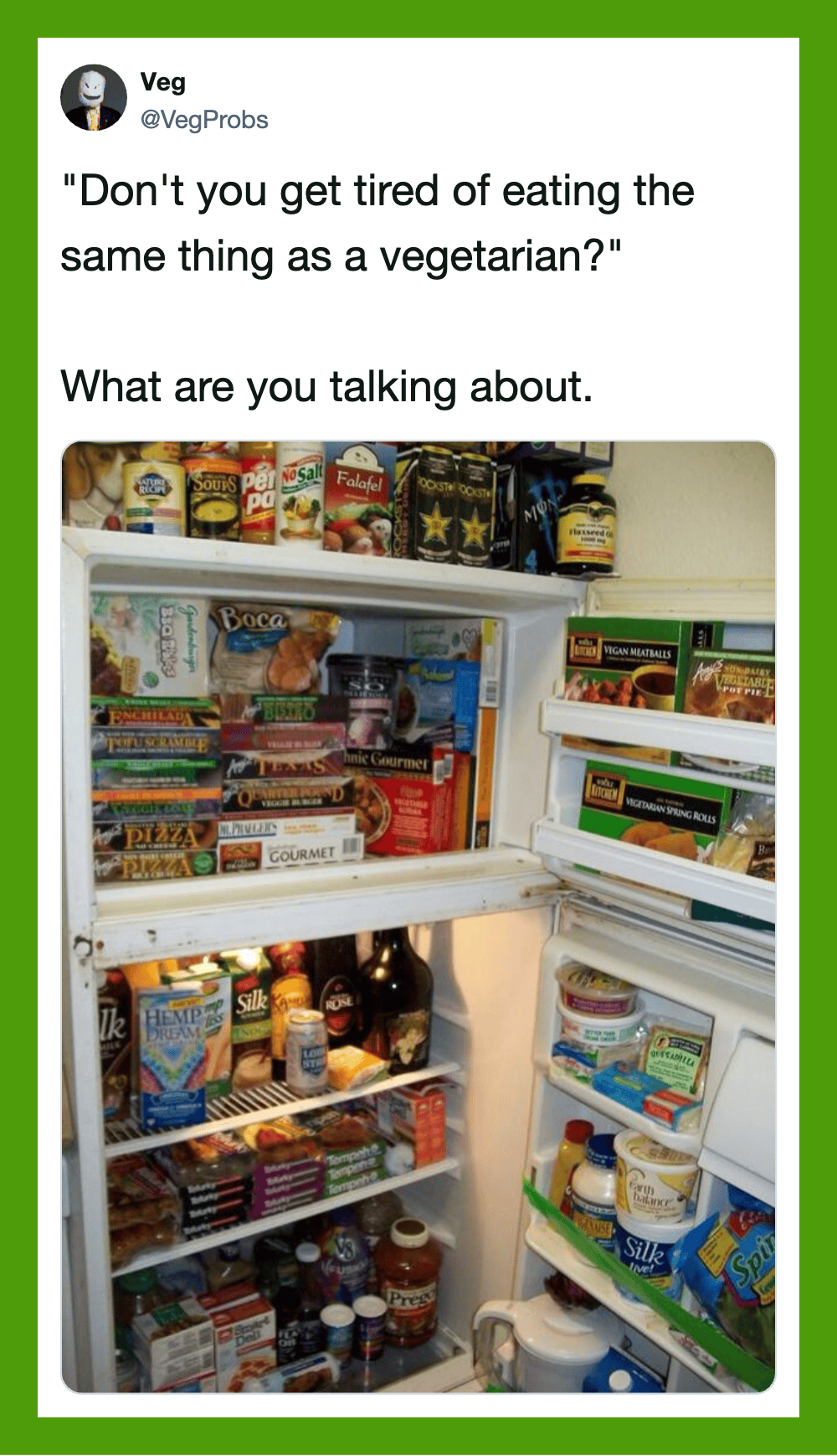 Open fridge with various vegetarian products and snacks inside.