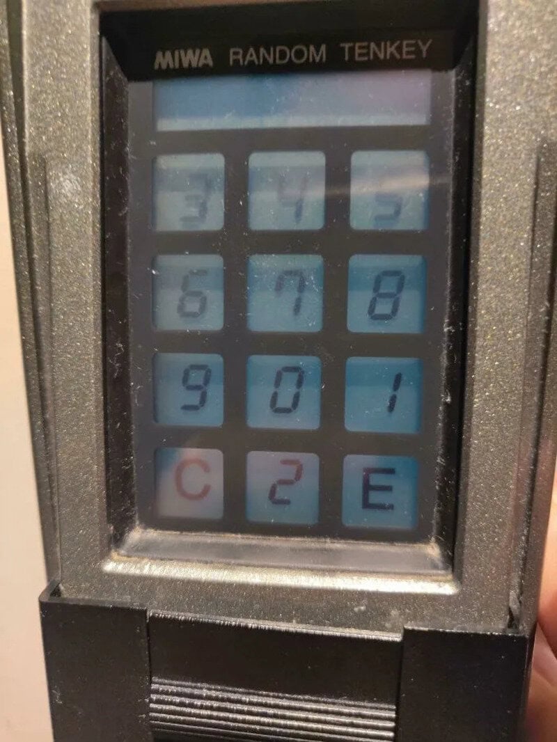Miwa Random Tenkey calculator with blue buttons and a small screen.