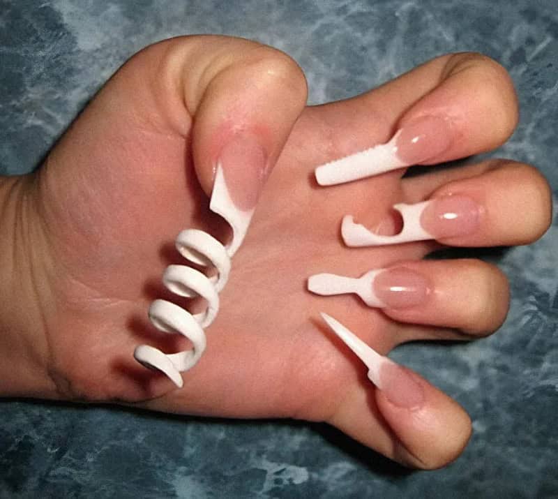 Nail polish bottles with nails shaped like a spiral, a stick, a fish, and a knife.
