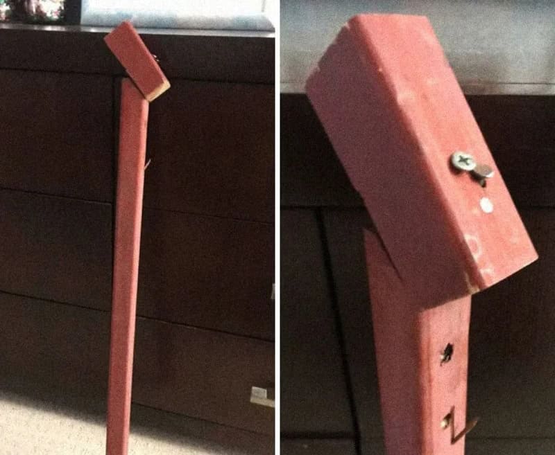 DIY wooden stand with a tilted top, held together with screws and nails.