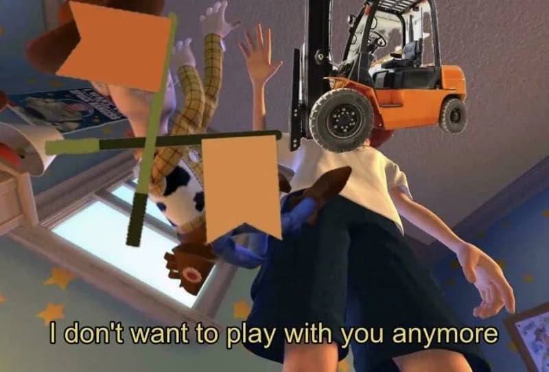 Child with a toy forklift and plush toys hanging from the ceiling.