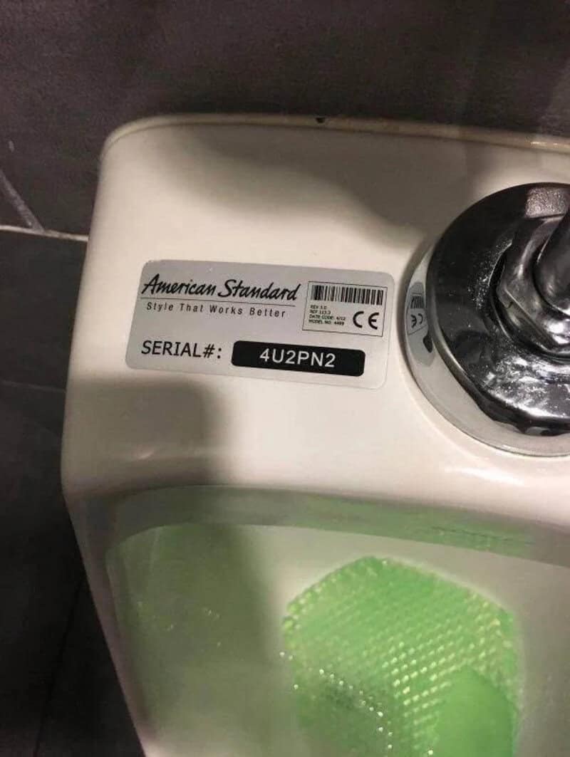 Close-up of washing machine with serial number 4U2PN2 and American Standard label.