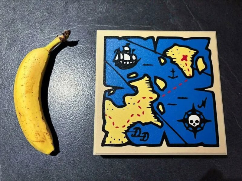Colorful puzzle with map and pirate symbols next to a banana.