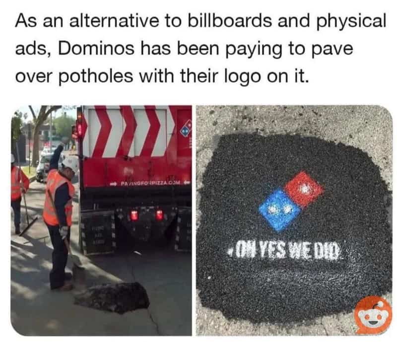 Domino's logo painted on asphalt with the text "OH YES WE DID".