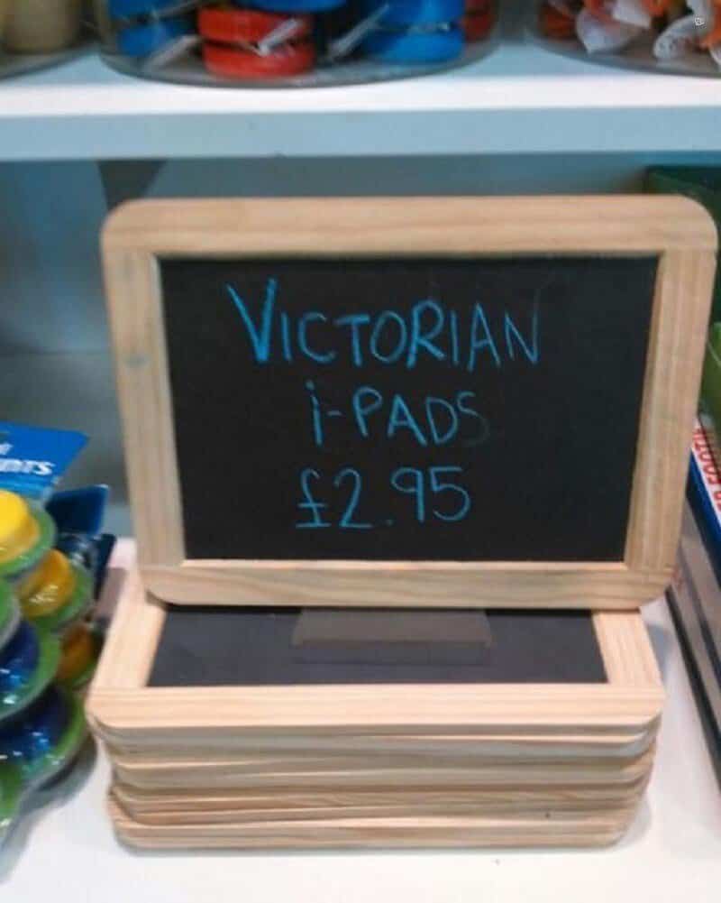 Victorian i-Pads £2.95 written on a small blackboard in a store.