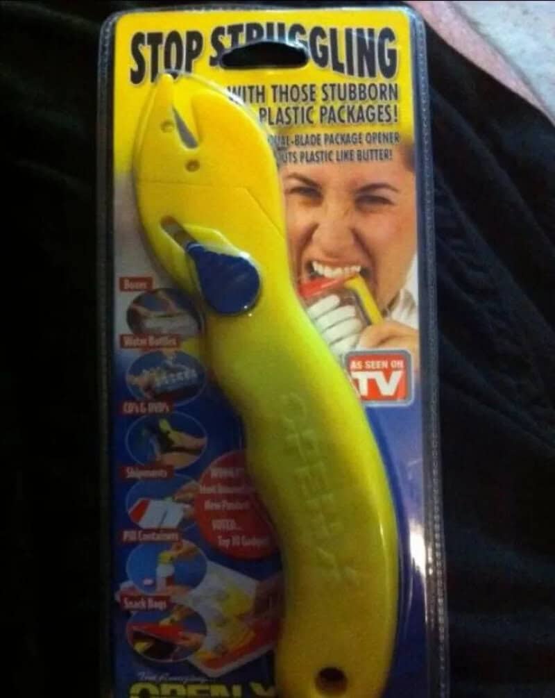 Yellow plastic package opener with blue blade, designed to cut plastic packages.