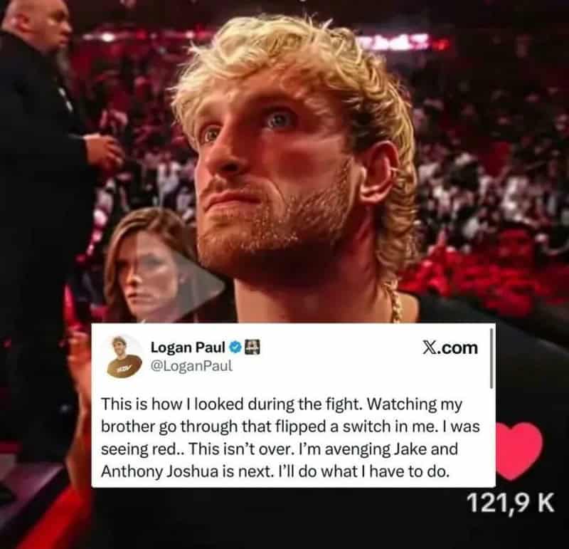 Close-up of a man with blond curly hair and a beard at a fight event.