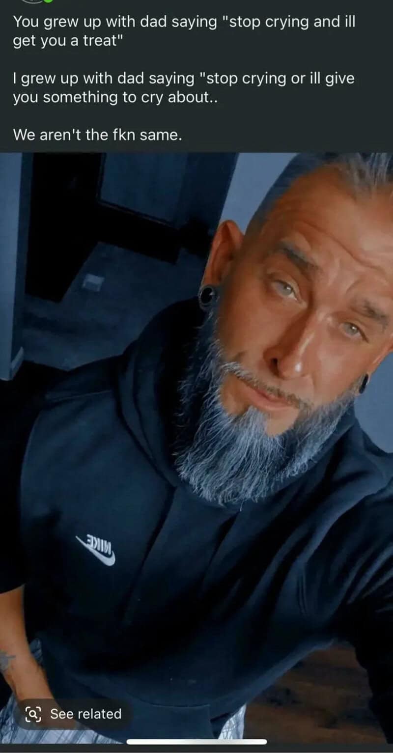 Man with a beard and earrings wearing a black Nike hoodie, looking at the camera.