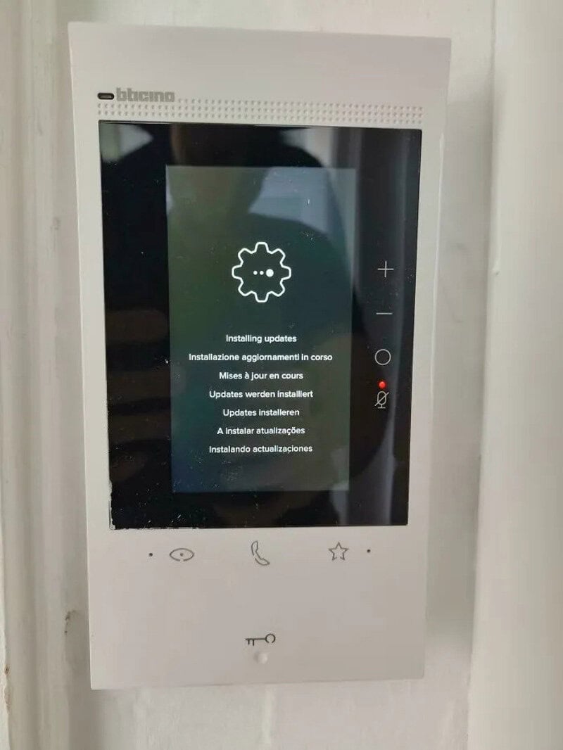 Smart home device screen showing software update installation in progress.