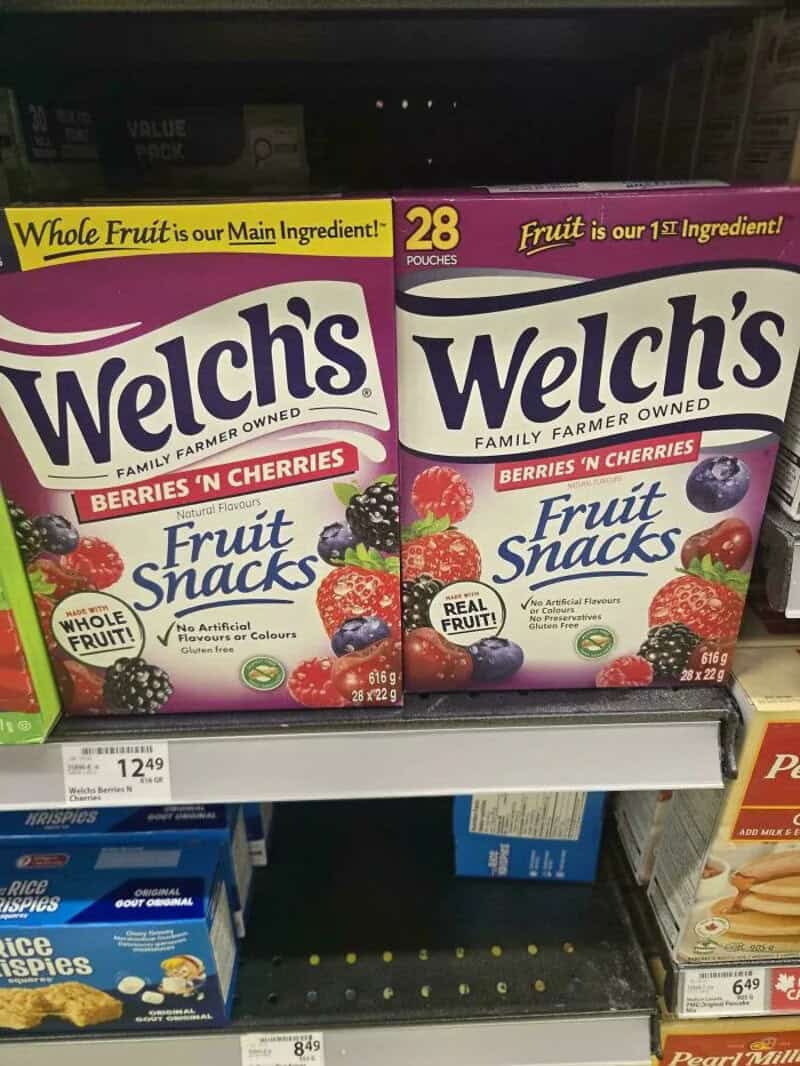 Welch's Berry 'n' Cherries Fruit Snacks boxes on store shelf.