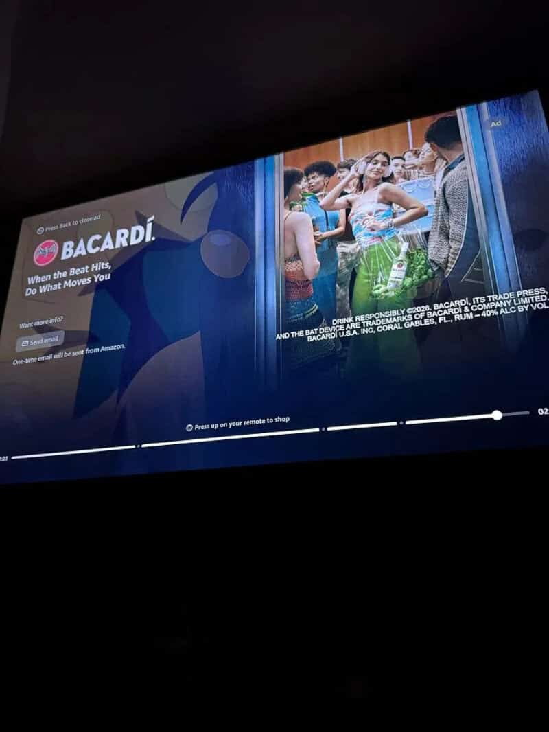 Bacardi advertisement with a group of people at a party or event.