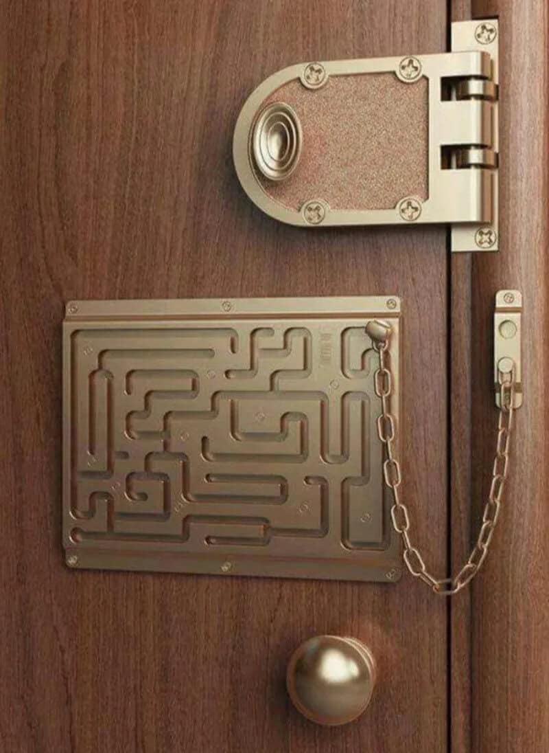 Door with maze lock, chain, and round handle, part of a security system.