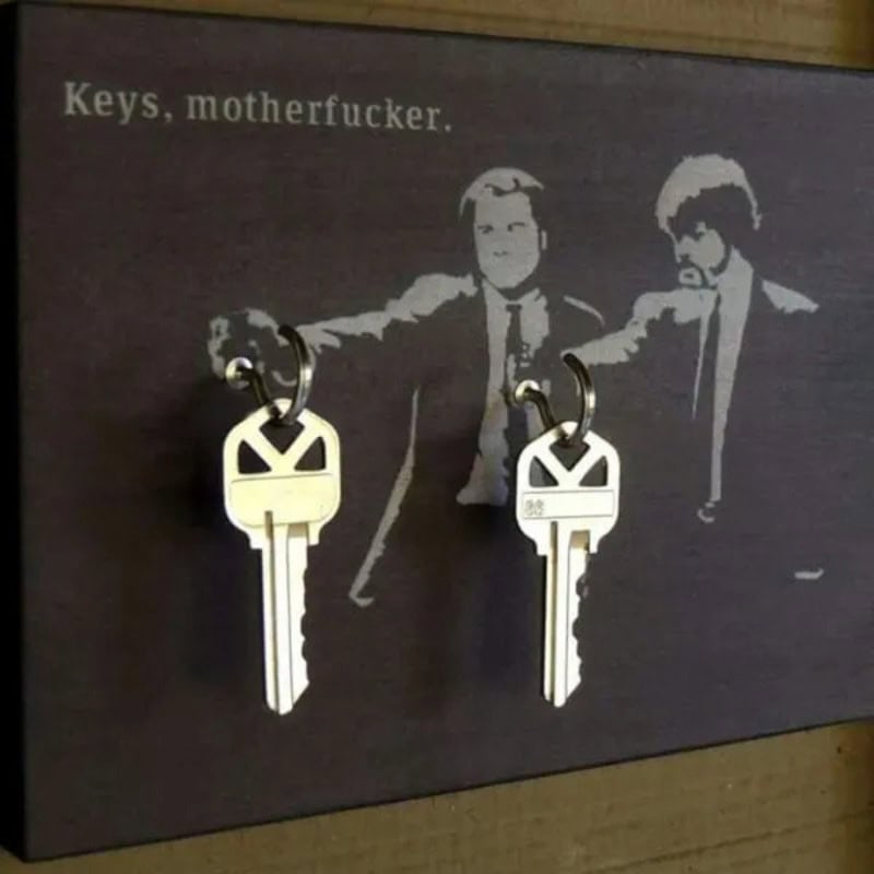 Keys with a humorous sign reading 'Keys, motherfucker.'.