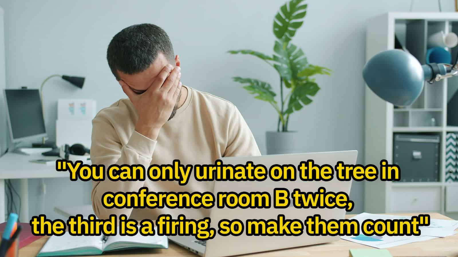 Man covering face with hand in office, quote about urinating on conference room tree.