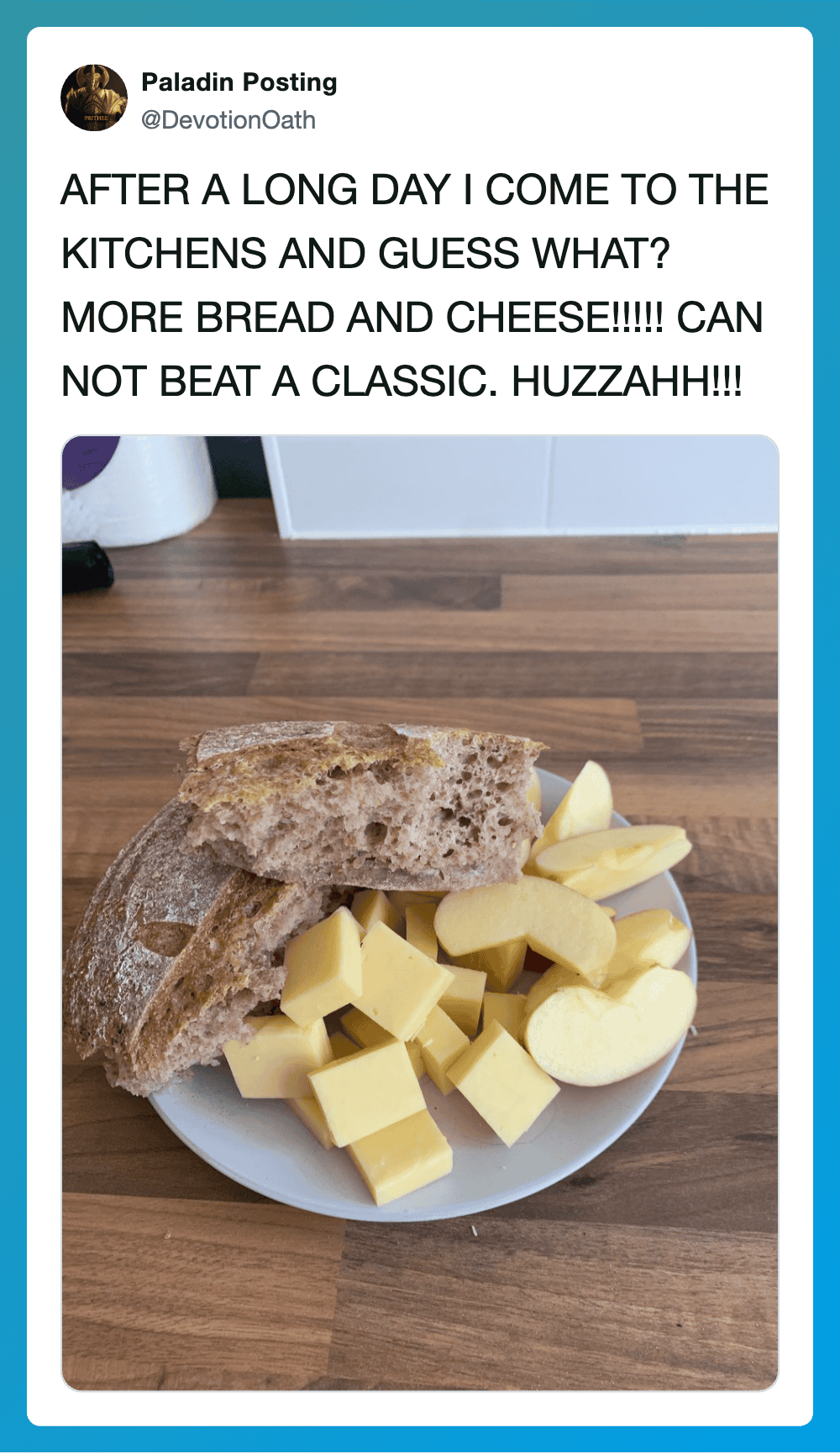 A plate of bread, cheese, and apple slices with a kitchen background.