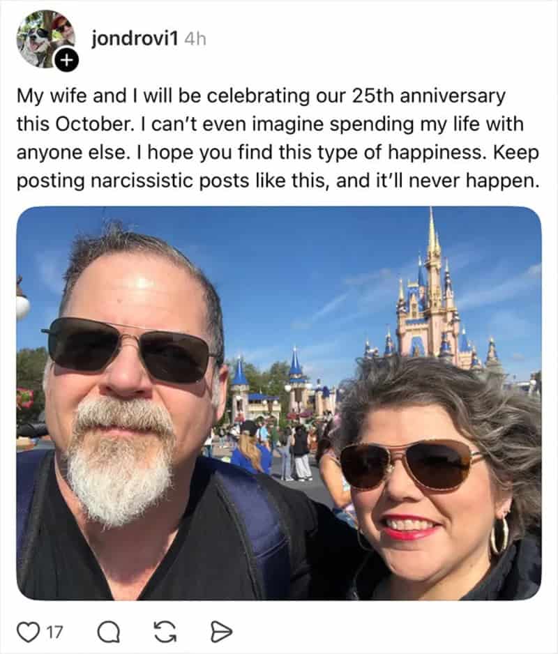 Celebrating 25th anniversary at Disney with wife, castle in background.