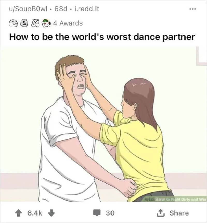 Person holding another person's face with both hands, appearing to push them away.