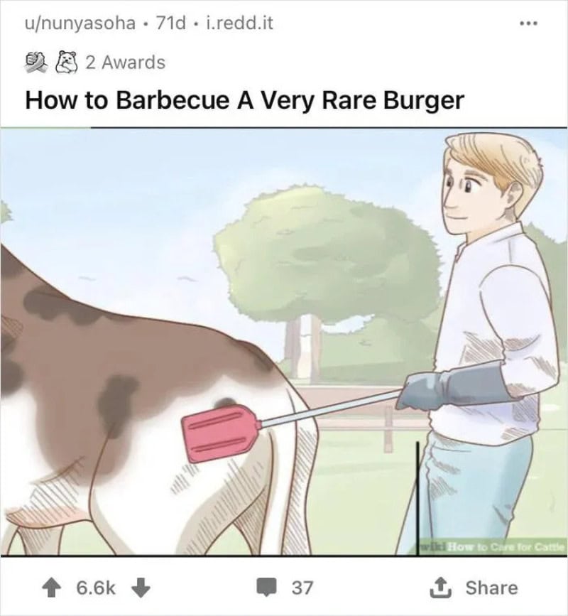 Person barbecuing a cow with a spatula, with a tree and blue sky in background.