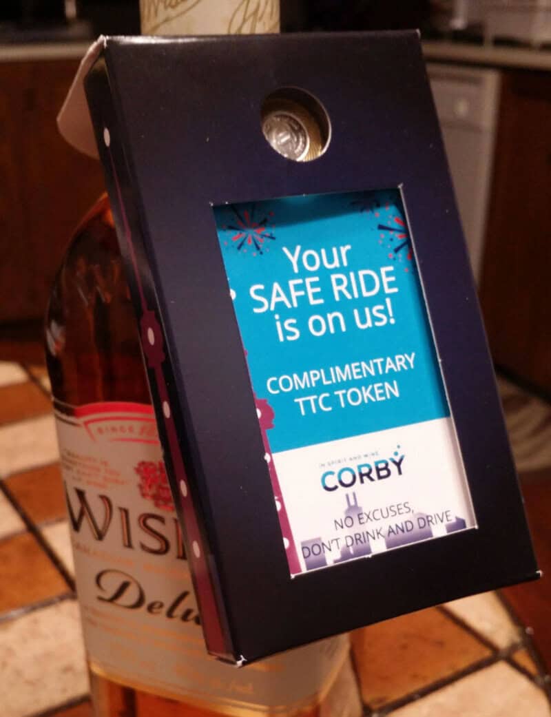 Digital screen in a black box with a message about safe ride and free TTC token.