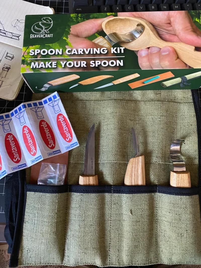 BeaverCraft spoon carving kit with knives and tools in a green case.