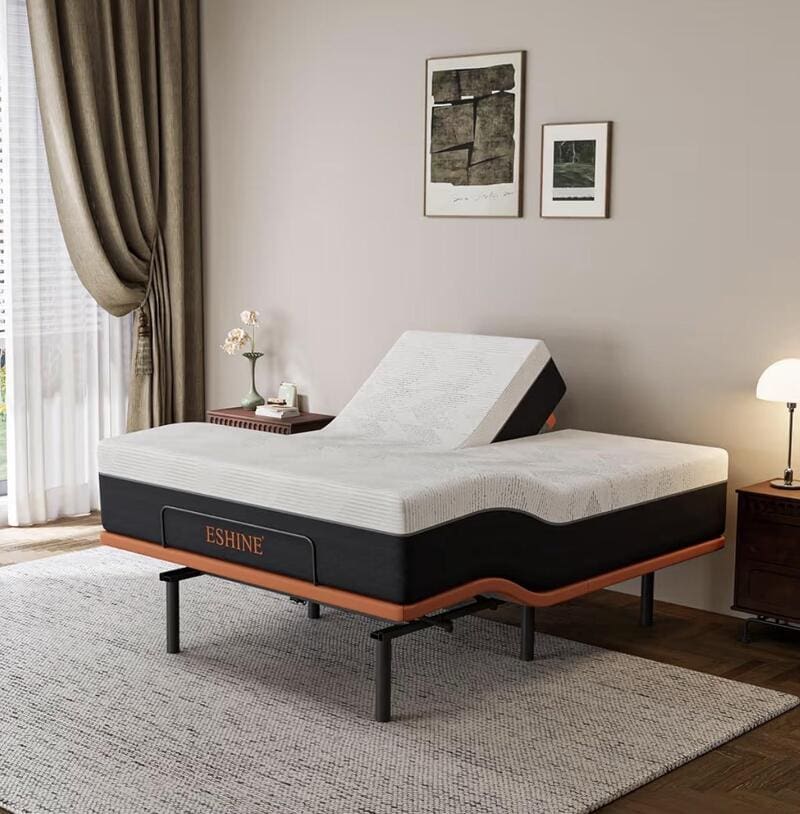 Adjustable mattress in a modern bedroom with artwork and lighting.