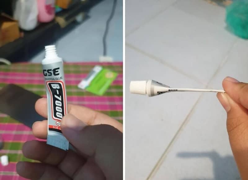 Tube of adhesive B-7000 clear glue held in hand with applicator.