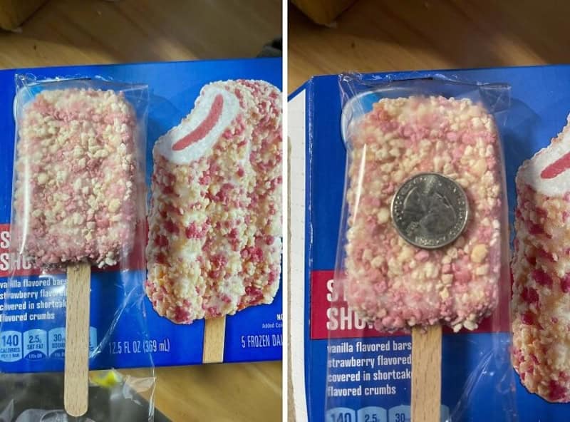 Two pink vanilla creme bars with crumb topping on sticks, still in plastic wrapper on blue box.