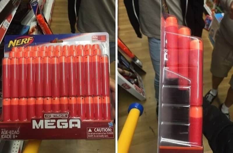 Nerf Mega Nerf Guns package on store shelf with bright orange barrels.