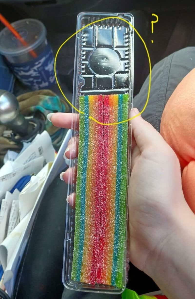 Rainbow candy rainbow strips in plastic packaging, circled area near top.