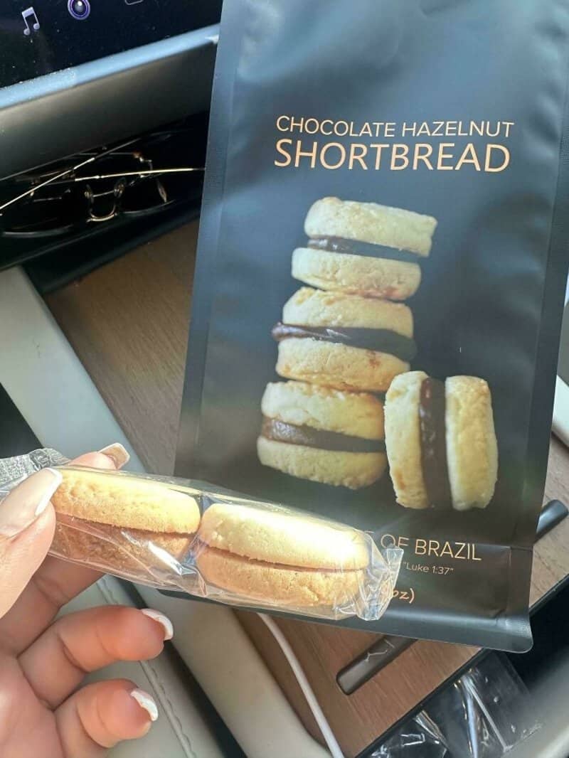 Chocolate hazelnut shortbread cookies in packaging with stacked cookies image.