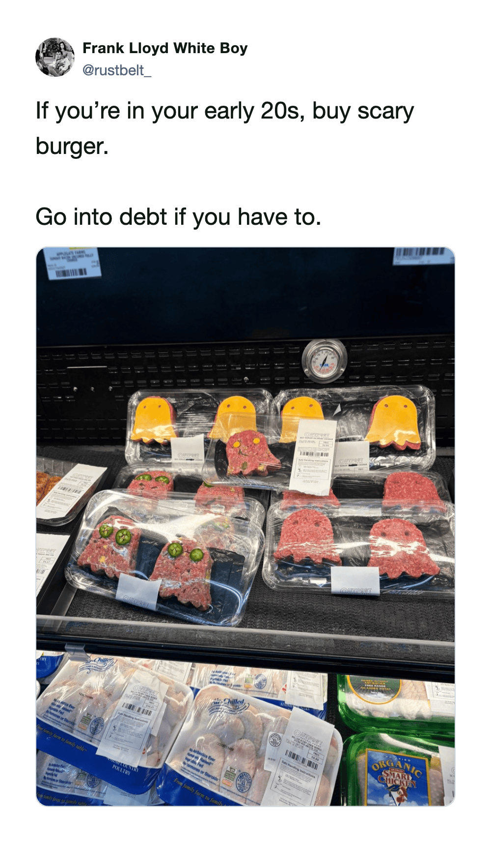 Display of packaged raw meat and burger patties in a grocery store.