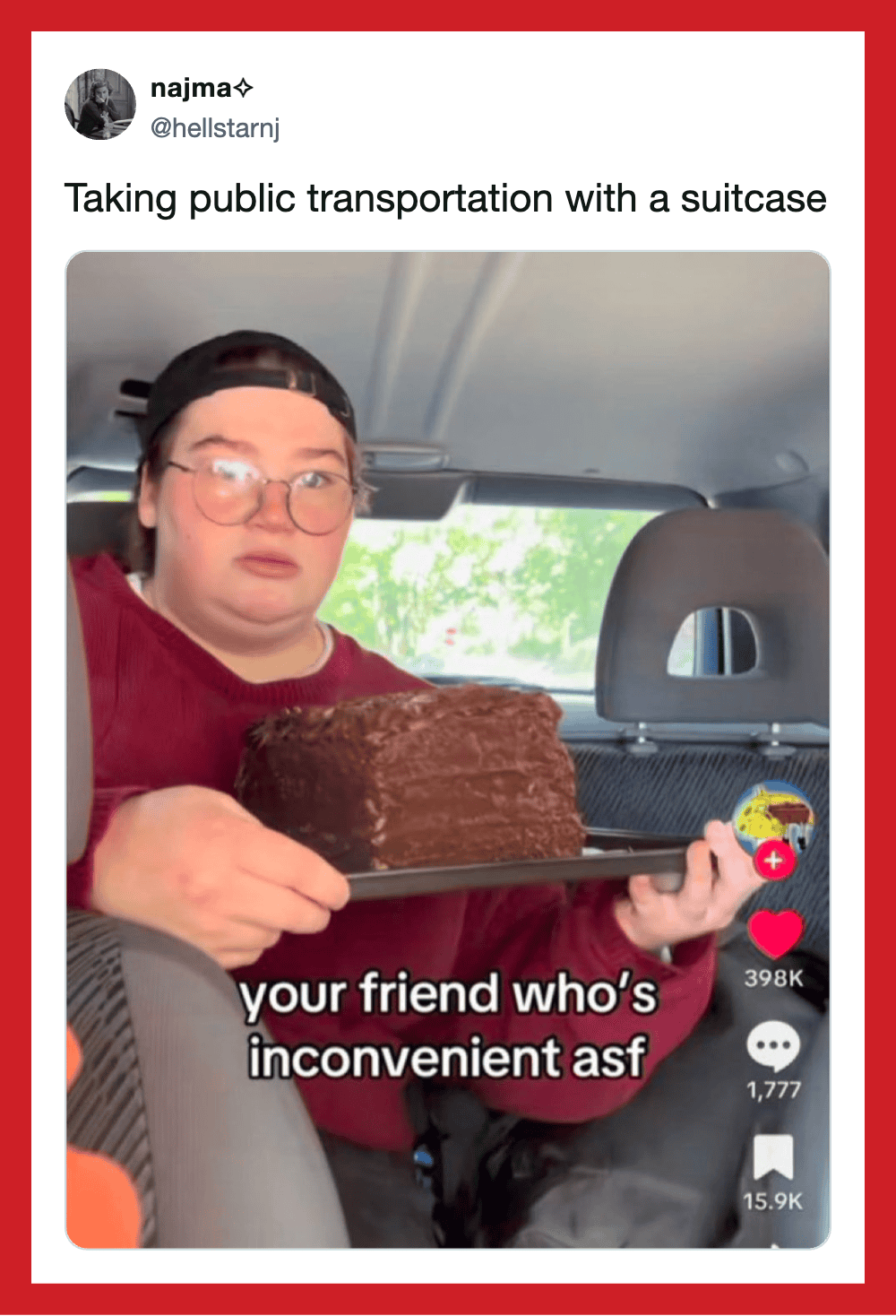 Person with glasses and a cap holding a large chocolate cake in a car.