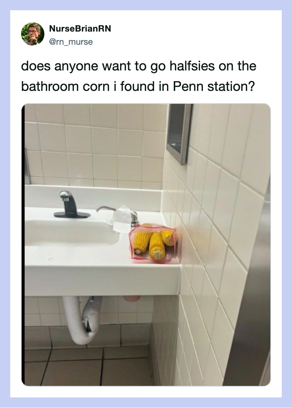 A bathroom sink with a pink tray holding yellow and orange half-sies corn.