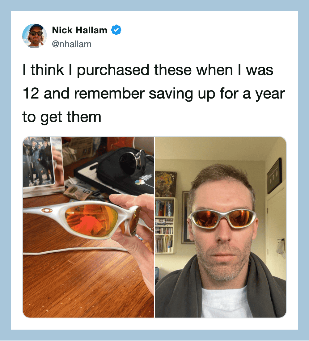Man wearing sunglasses, with a collection of sunglasses on a table, tweet about buying sunglasses at.