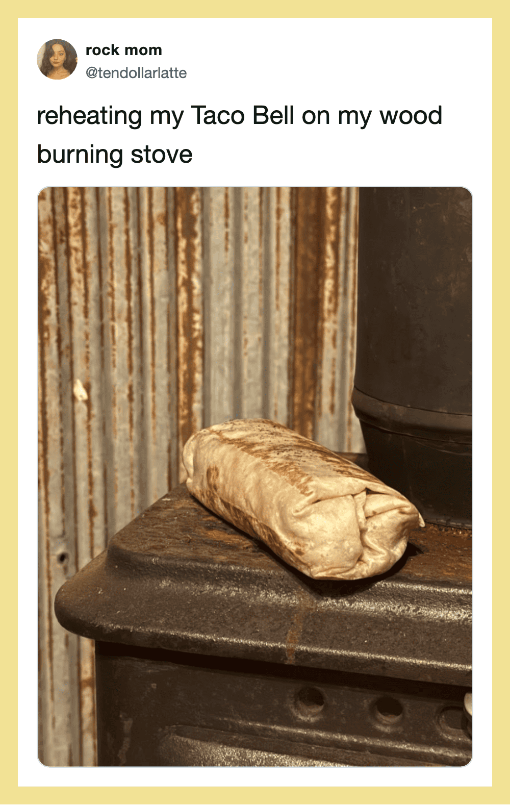 Taco Bell burrito reheated on a wood burning stove with a rustic background.