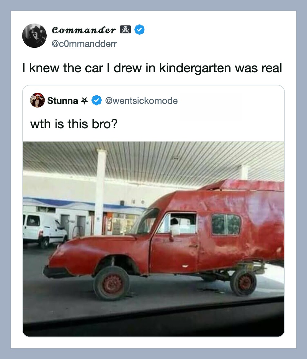 Red toy car built on a truck chassis at a gas station.