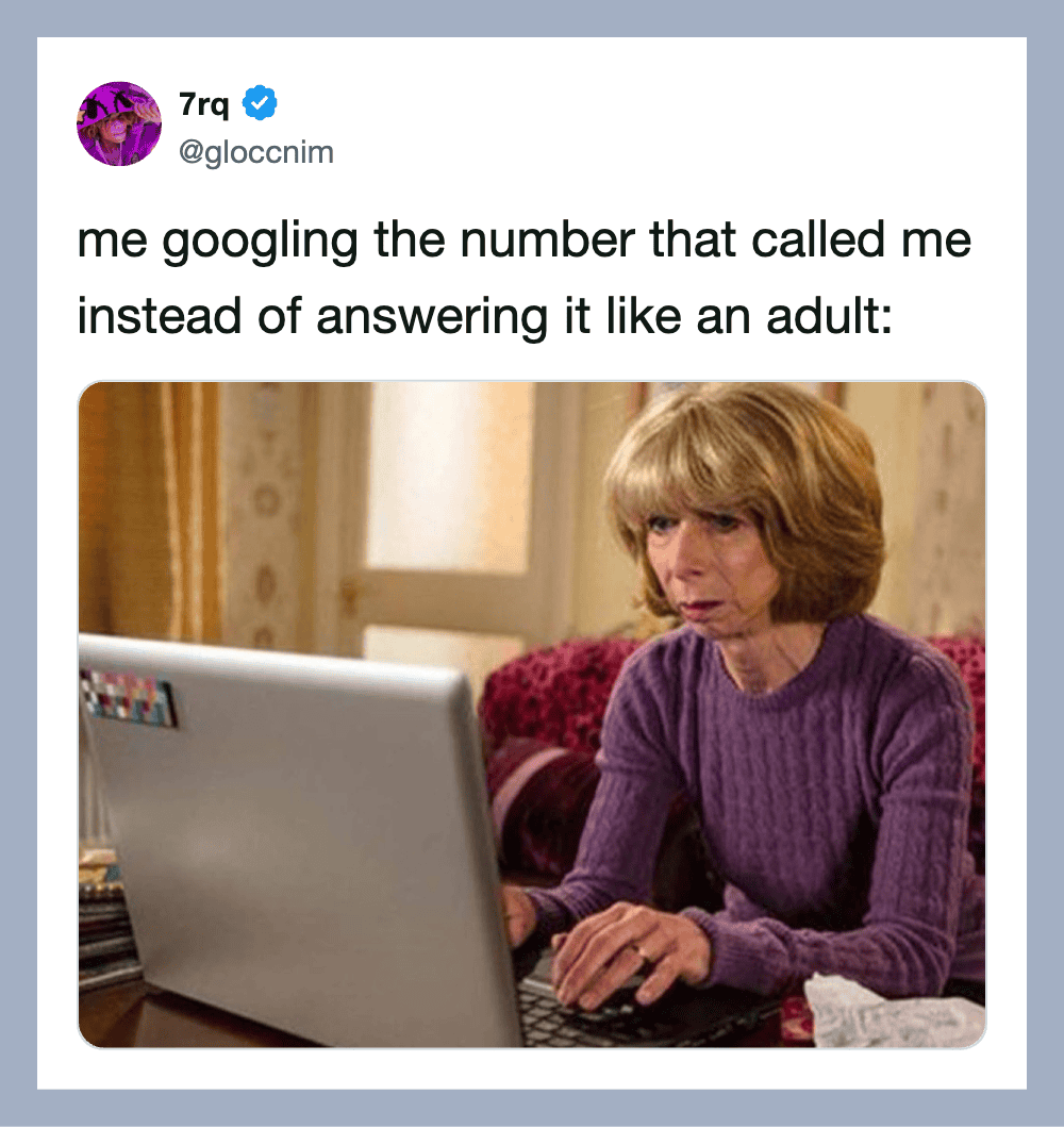 Woman with short blonde hair looking at laptop with a serious expression.