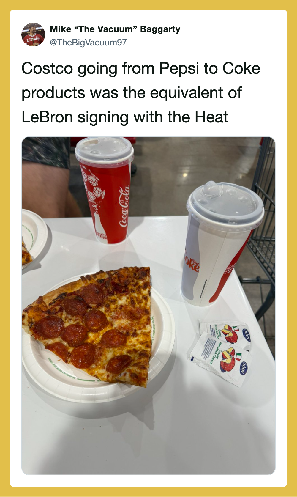 Pizza slice with pepperoni, two Coca-Cola drinks, and a napkin on a table.